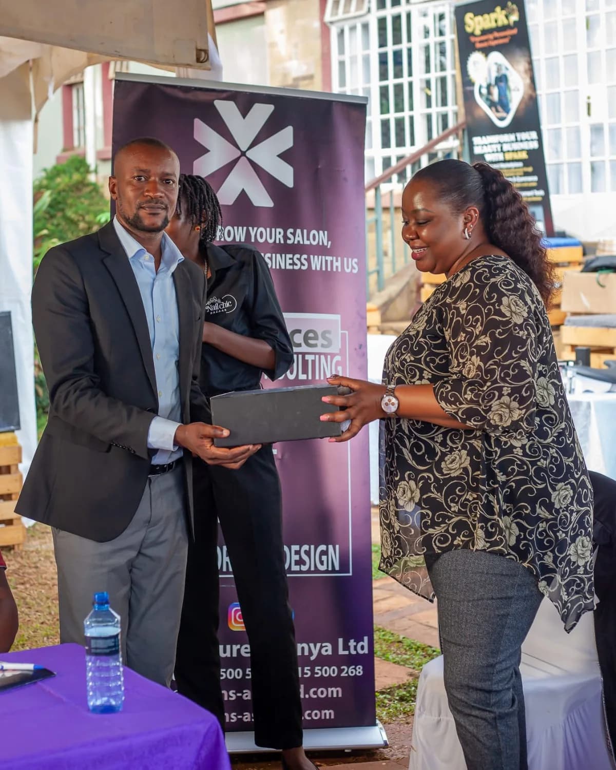Salons Assured supporting a beauty business owner during an industry event